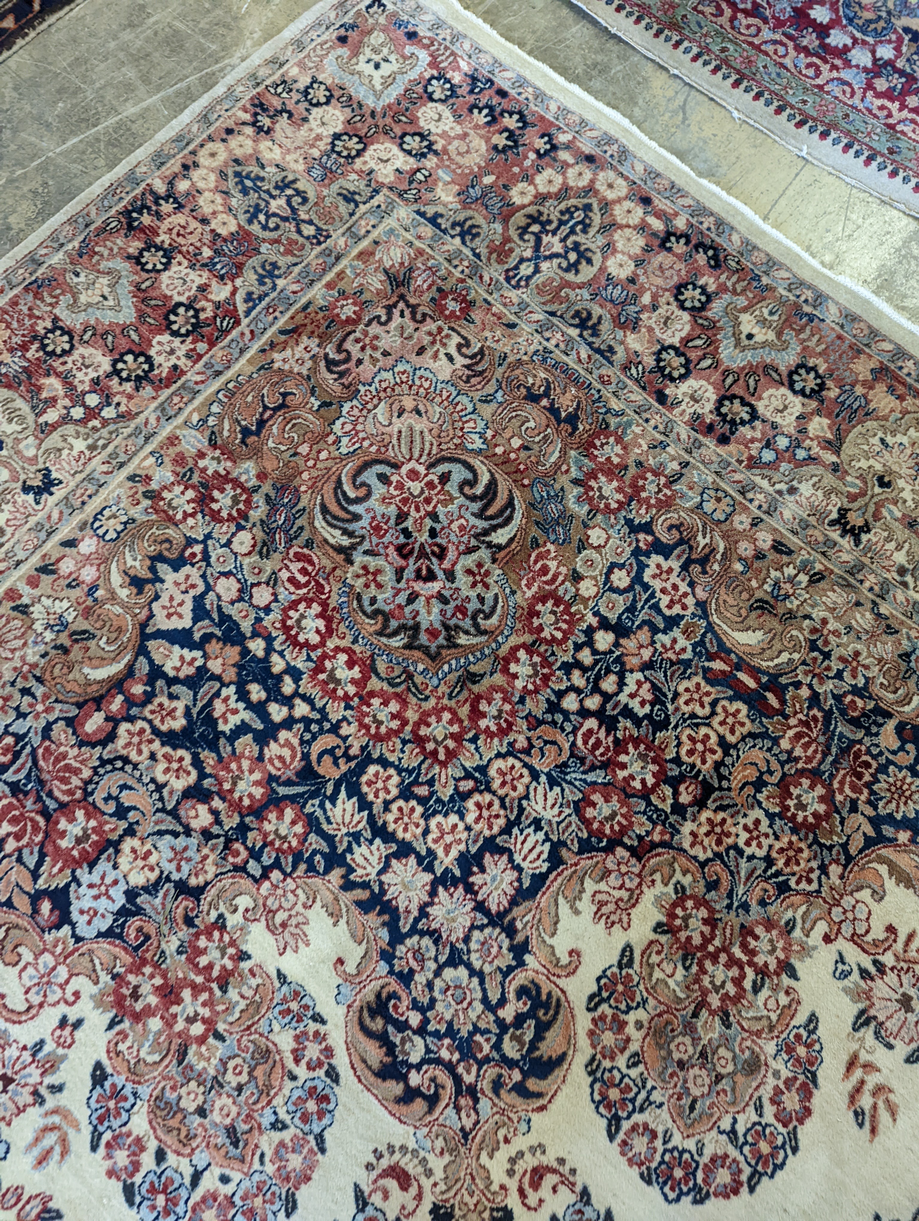 A North West Persian ivory ground carpet, 410 x 310cm